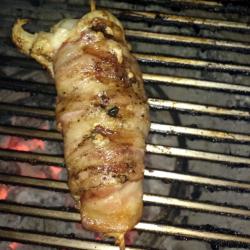 bacon wrapped lobster on the grill